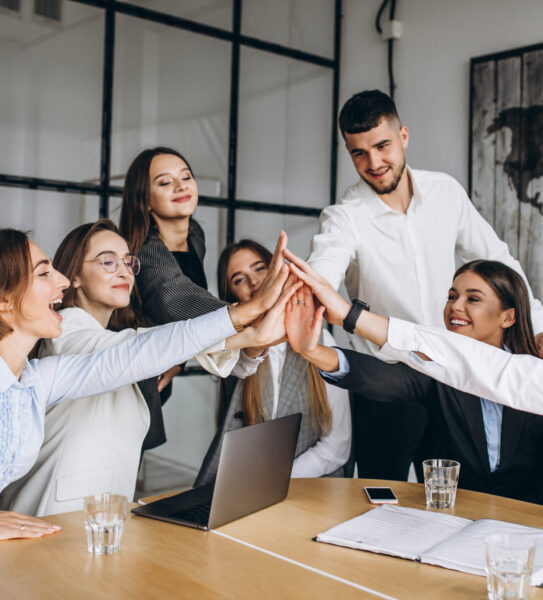 Group of people working out business plan in an office Group of people working out business plan in an office